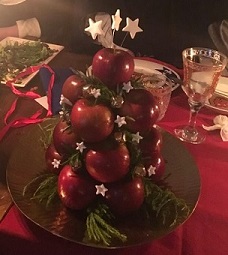 A tower of apples decorated with brass bells and hand made sugarpaste stars & flowers, a soteltie made for Southron Gaard's Festa di Natale event, 2018